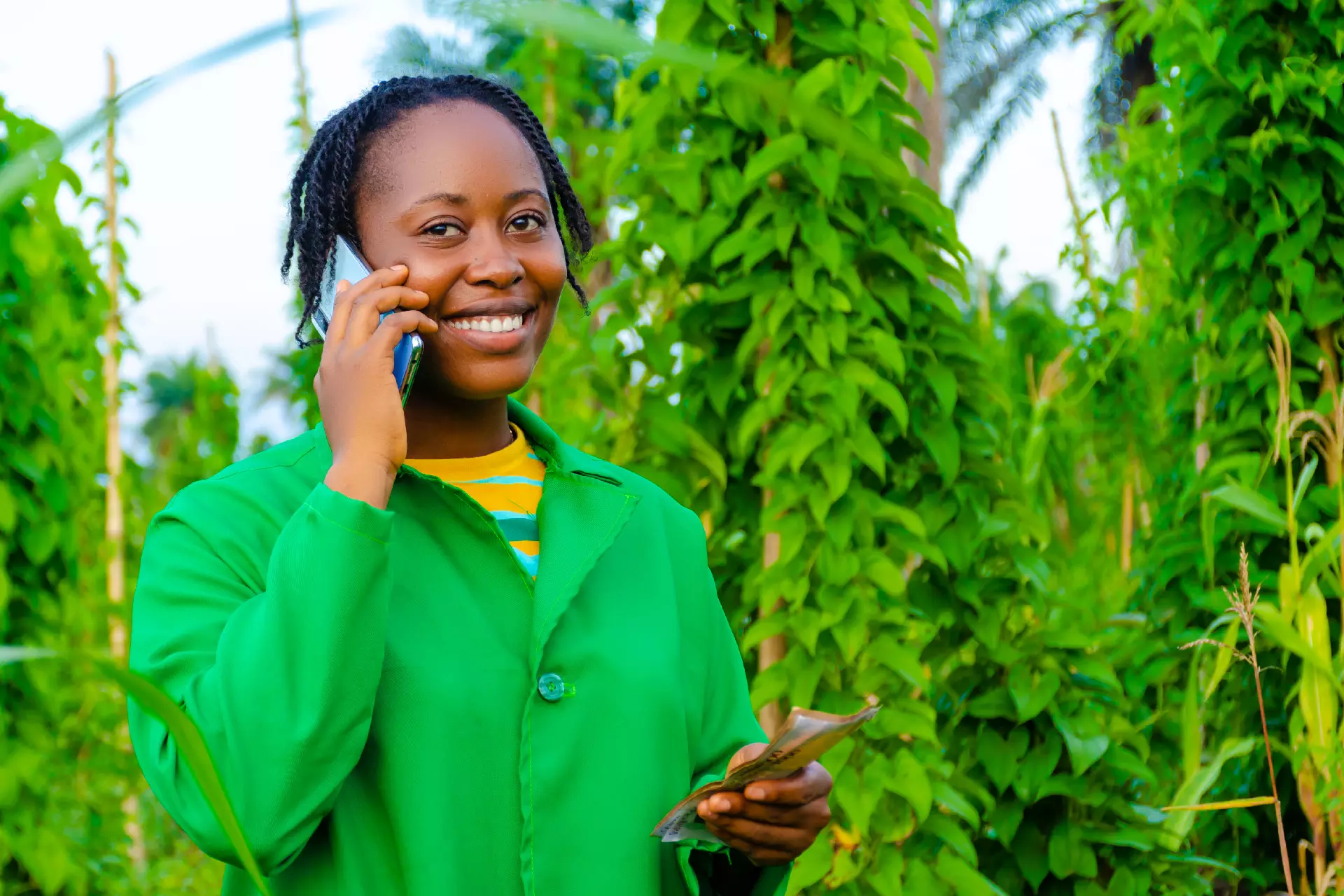 Growmate Uganda team member communicating with farmers
